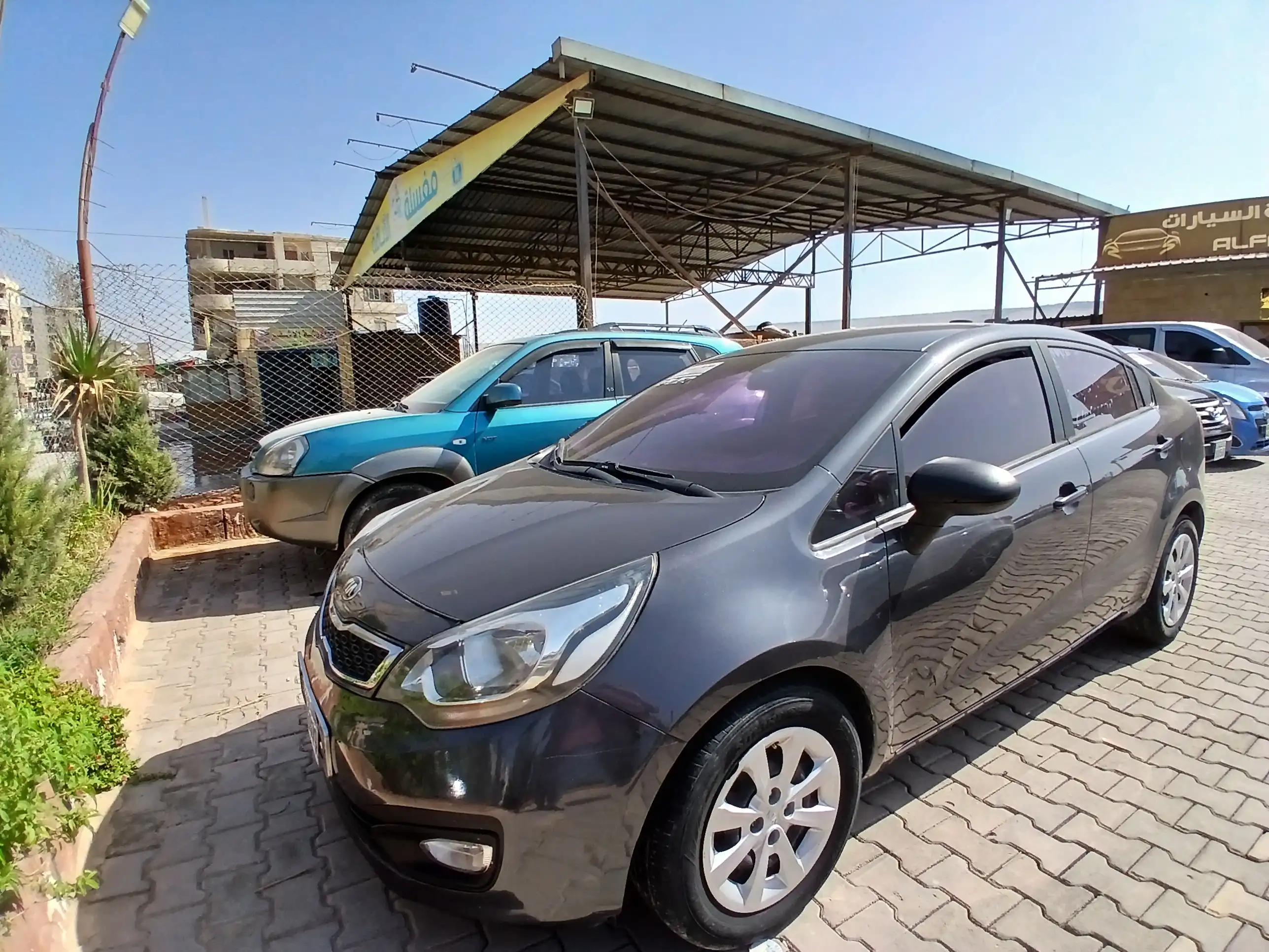 kilometrage car sale kia pride standard sedan used 2014 aleppo xe card image
